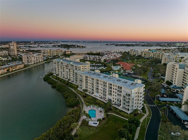 aerial view at dusk with a water view