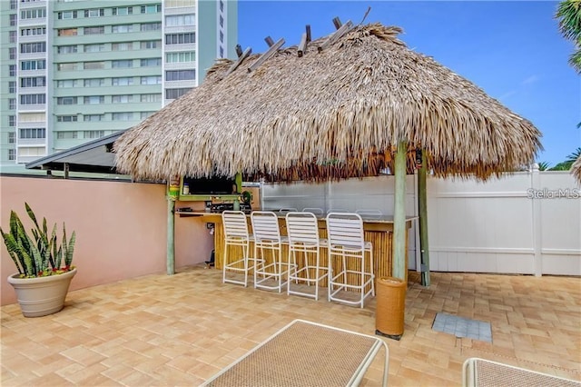 view of patio featuring an outdoor bar