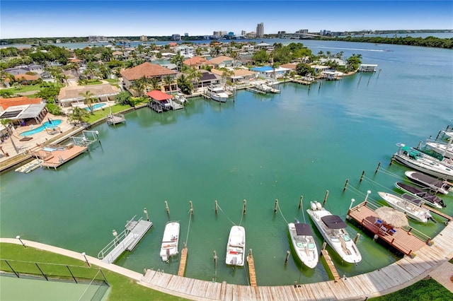 birds eye view of property with a water view