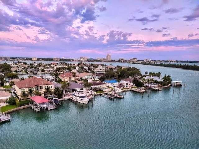 aerial view at dusk with a water view