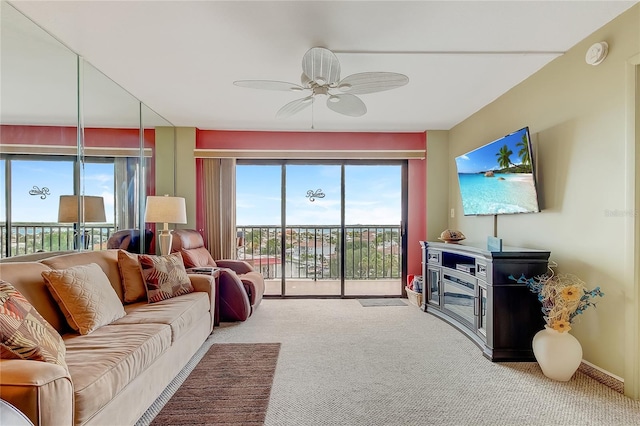 carpeted living room featuring plenty of natural light and ceiling fan