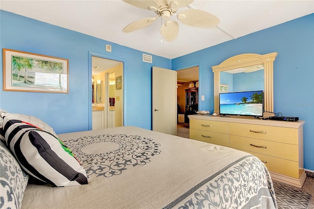 carpeted bedroom featuring ensuite bathroom and ceiling fan