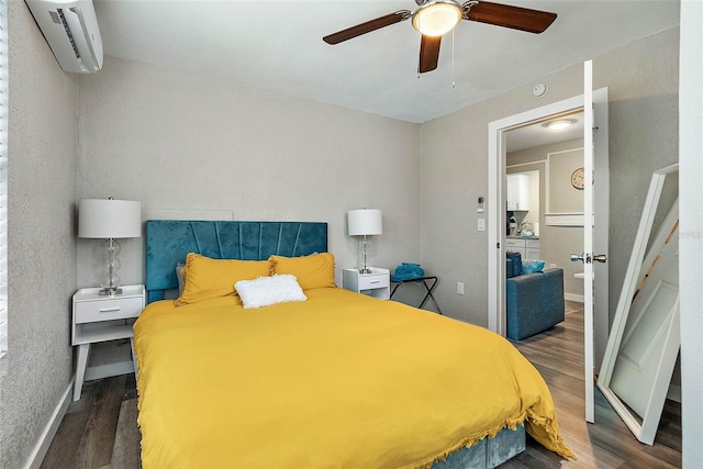 bedroom with a wall mounted air conditioner, ceiling fan, and dark hardwood / wood-style flooring