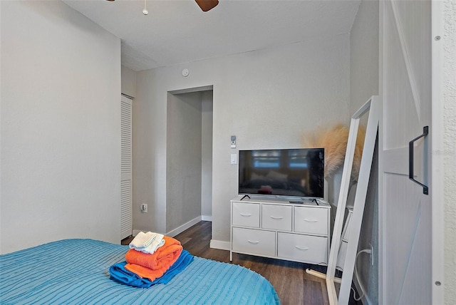 bedroom featuring dark hardwood / wood-style floors and ceiling fan