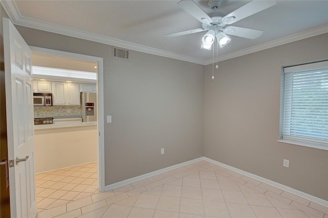 spare room featuring light tile patterned flooring, ceiling fan, and ornamental molding