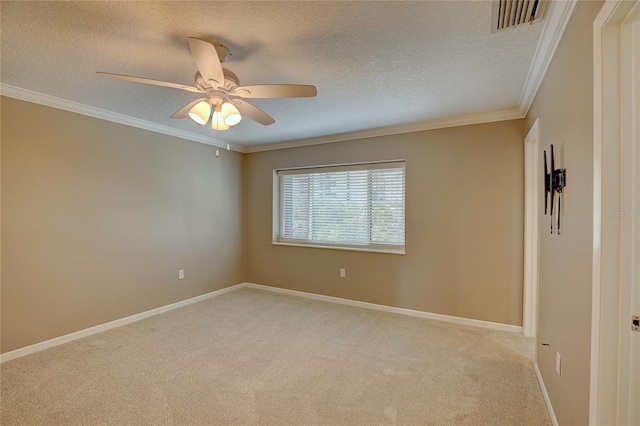 unfurnished room with light carpet, ceiling fan, crown molding, and a textured ceiling