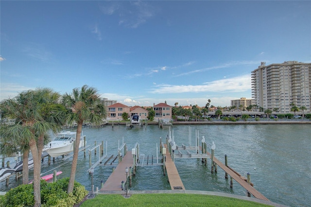 view of dock with boat lift and a water view