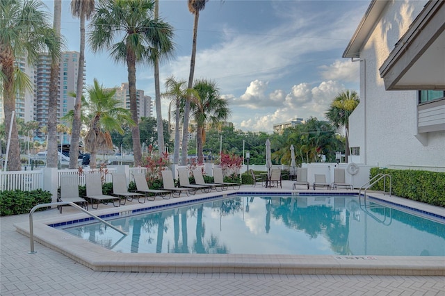 pool featuring a patio and fence