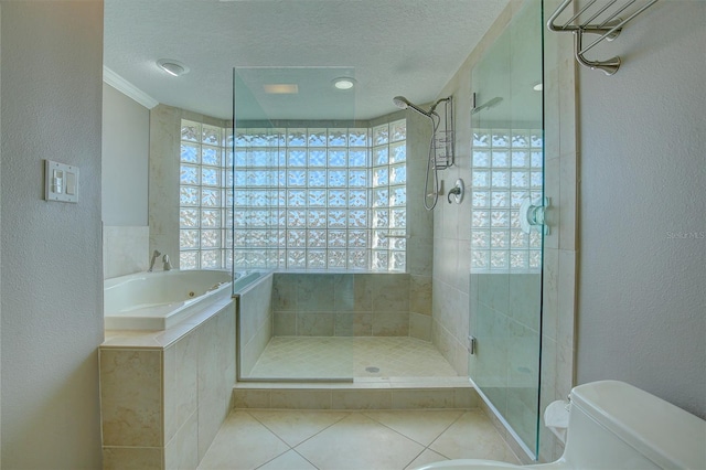 bathroom featuring plenty of natural light, a shower stall, a textured ceiling, and toilet