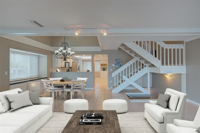 tiled living area with a chandelier, stairway, baseboards, and visible vents