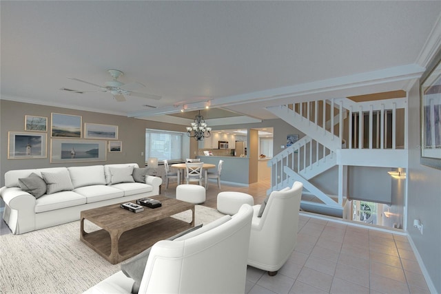 living room featuring stairway, light tile patterned flooring, ceiling fan with notable chandelier, and a wealth of natural light