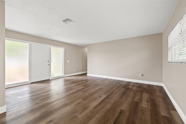 spare room featuring hardwood / wood-style flooring