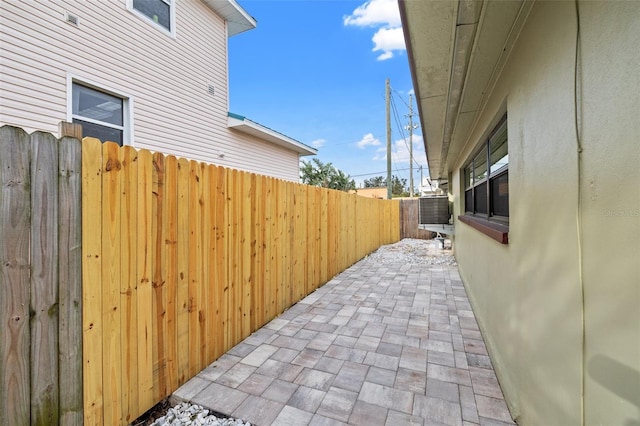 view of property exterior featuring a patio and central air condition unit