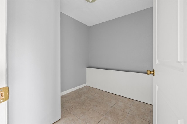 empty room with light tile patterned floors