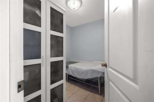 bathroom with tile patterned floors