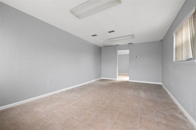 view of tiled spare room