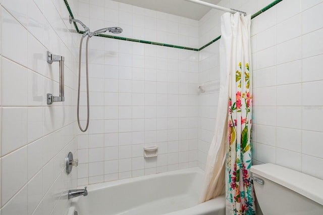 bathroom with shower / bath combination with curtain, tile walls, and toilet