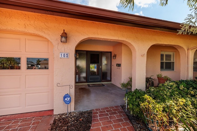 entrance to property featuring a garage