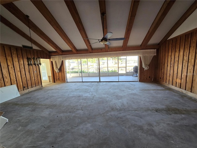 unfurnished living room featuring lofted ceiling with beams, ceiling fan, wooden walls, and concrete floors