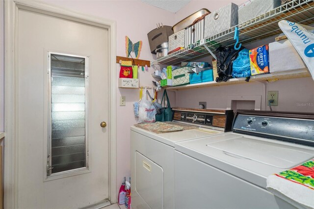 washroom with washer and dryer