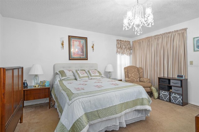 carpeted bedroom with a textured ceiling and an inviting chandelier