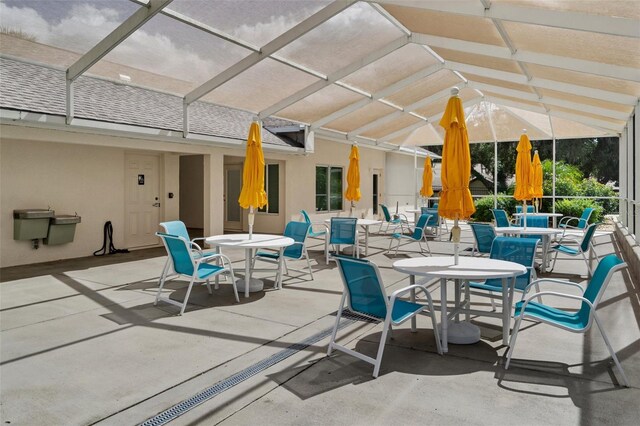 view of patio / terrace with a lanai