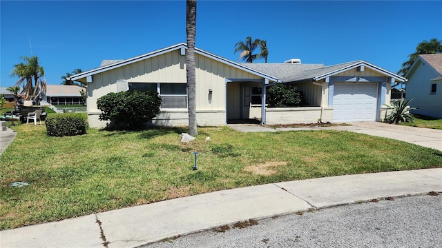 single story home with a front lawn and a garage