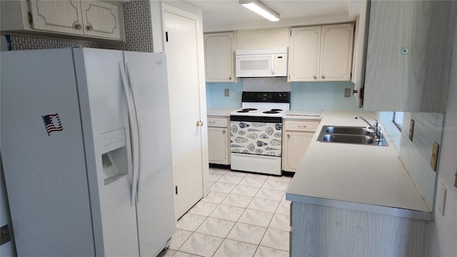 kitchen with backsplash, sink, white appliances, and light tile patterned floors