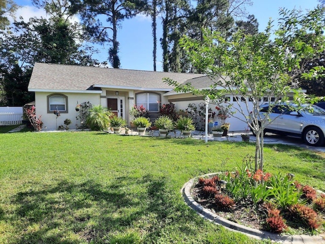 ranch-style home featuring a front lawn