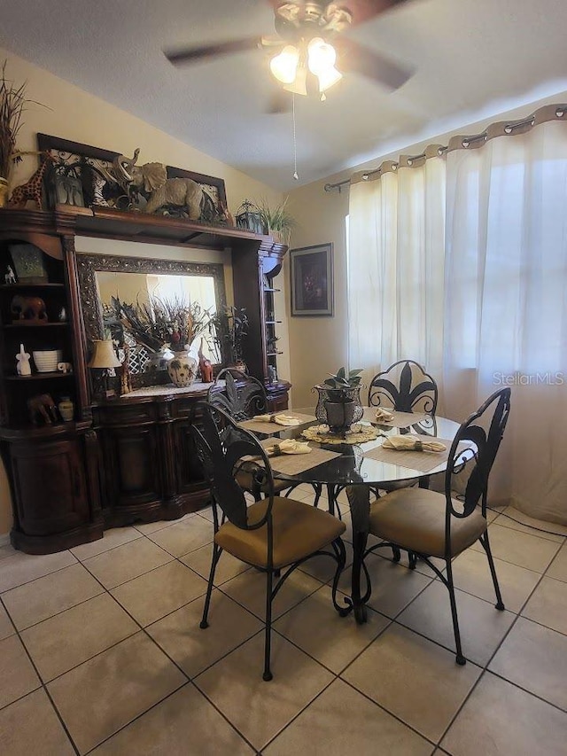 dining room featuring ceiling fan and light tile patterned floors