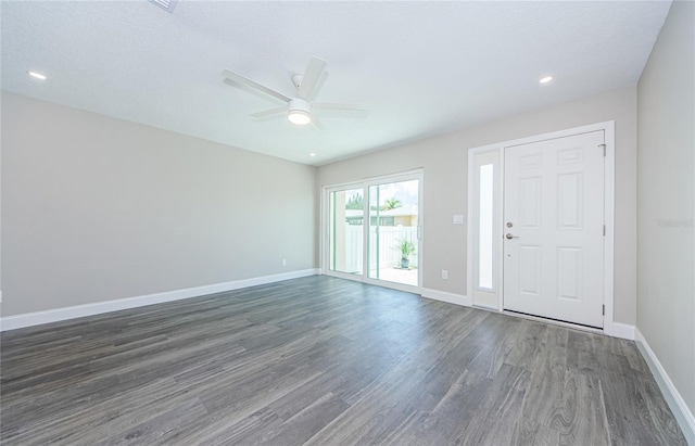 entrance foyer featuring ceiling fan, dark hardwood / wood-style floors, and a textured ceiling