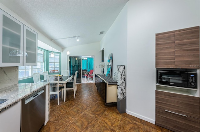 kitchen featuring light stone countertops, dishwasher, a textured ceiling, lofted ceiling, and white cabinets