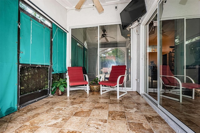 sunroom / solarium with ceiling fan