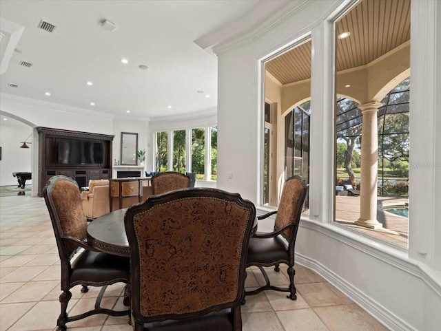 tiled dining area with crown molding