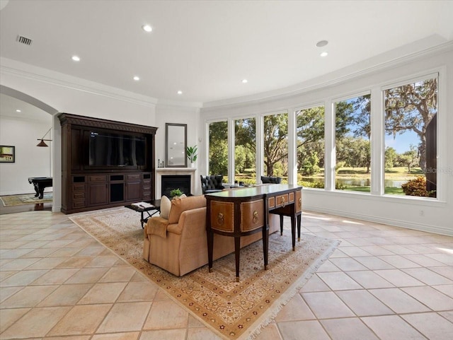 living room with crown molding, light tile patterned floors, and pool table