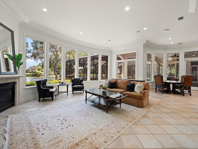 sunroom featuring ceiling fan