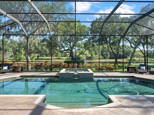 view of swimming pool featuring a lanai, an in ground hot tub, and a patio