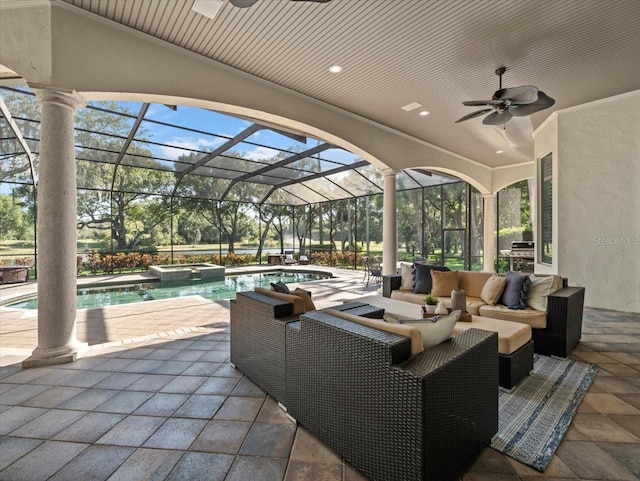 view of patio / terrace with glass enclosure, ceiling fan, an outdoor hangout area, and a pool with hot tub