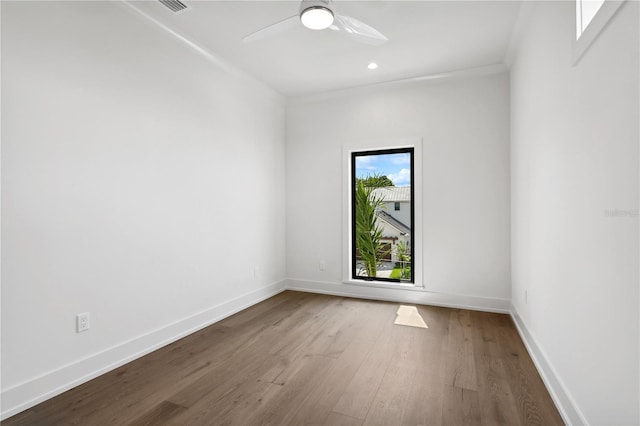 unfurnished room with baseboards, ceiling fan, wood finished floors, crown molding, and recessed lighting