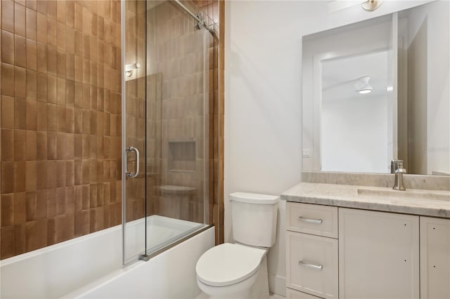 full bathroom with shower / bath combination with glass door, vanity, and toilet