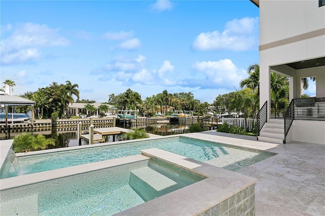 view of pool featuring an in ground hot tub