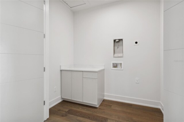 washroom featuring hookup for a washing machine, hookup for an electric dryer, laundry area, dark wood-type flooring, and baseboards