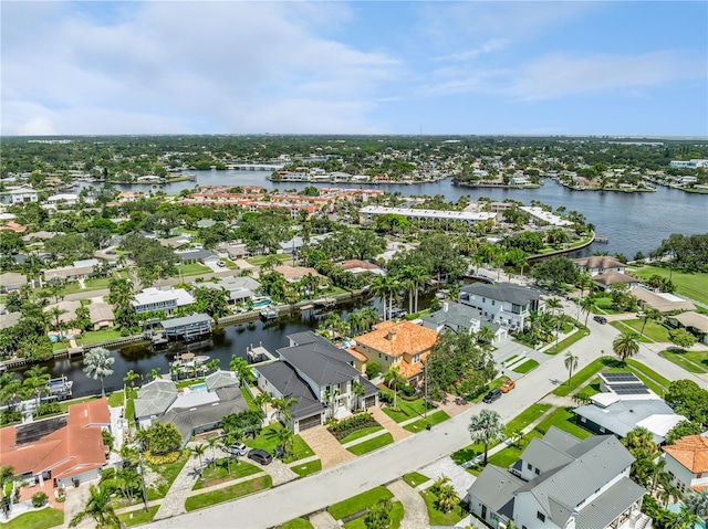 bird's eye view with a water view and a residential view