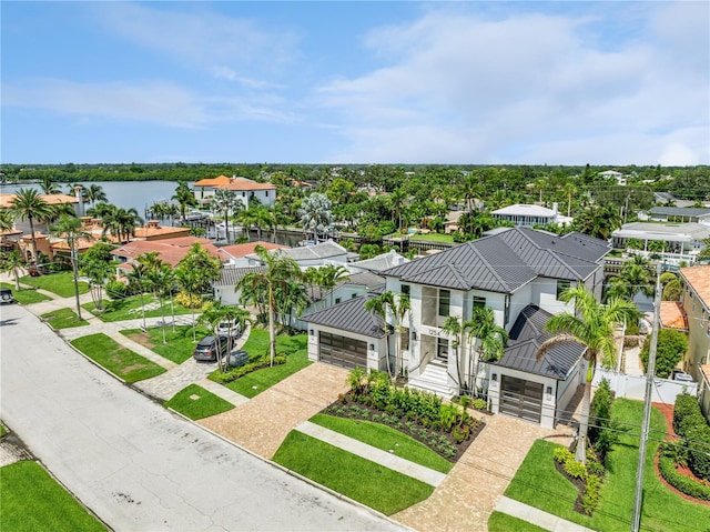 birds eye view of property featuring a water view