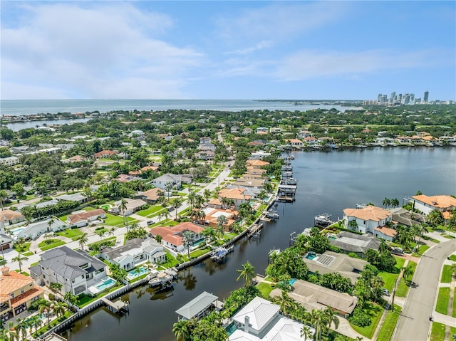 bird's eye view featuring a water view and a residential view