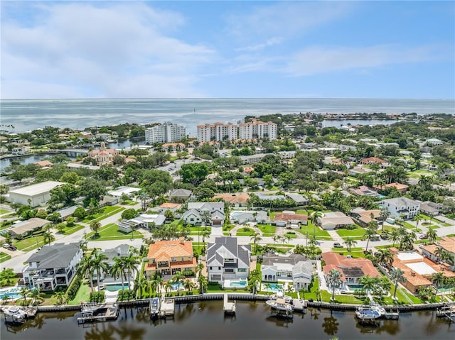 birds eye view of property featuring a water view and a residential view