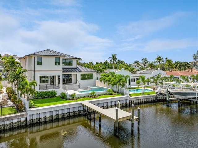 view of dock with a patio area and a water view