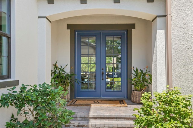 property entrance featuring french doors