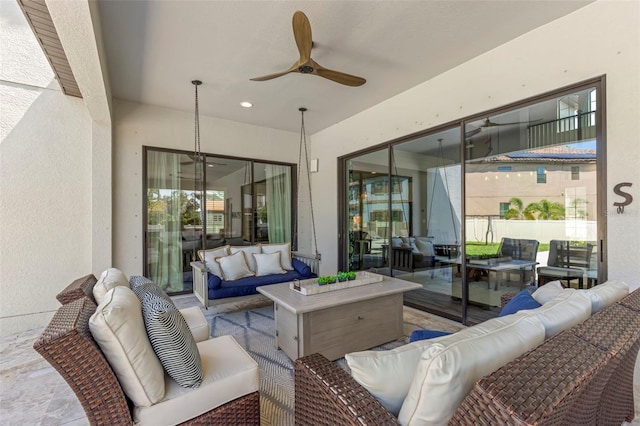 view of patio with outdoor lounge area and ceiling fan