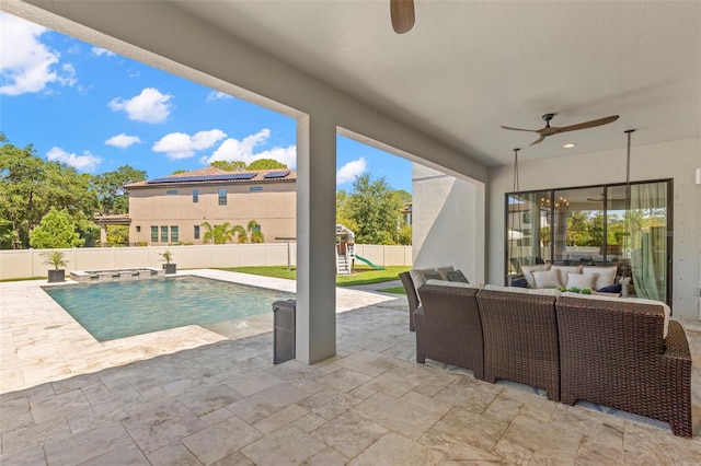 view of pool with an outdoor hangout area, a playground, ceiling fan, and a patio area